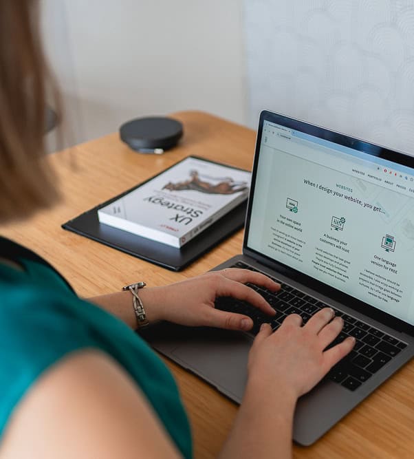 Barbora typing on keyboard, designing website